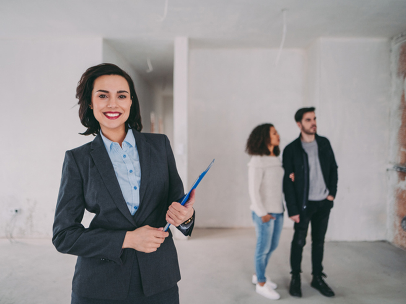 Real estate agent smiling to the camera